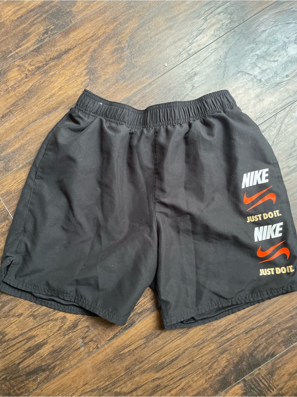 Nike Men’s Black Athletic Shorts with Orange & White Branding
